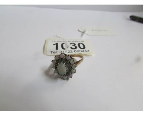 A 9ct gold floral cluster ring set opal, size P.