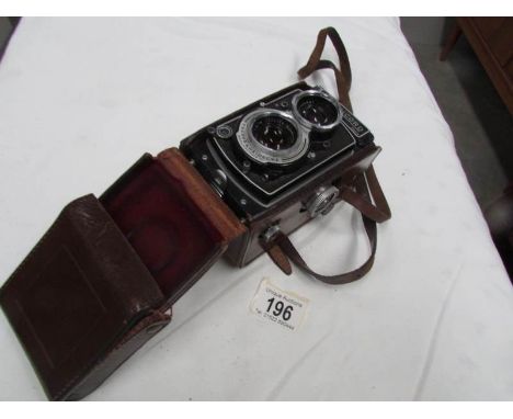 A Rolleicord camera in case.