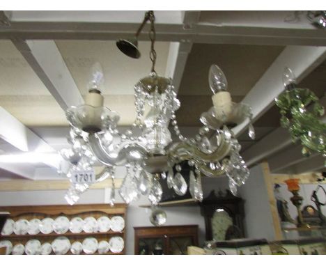 A 5 lamp glass chandelier.