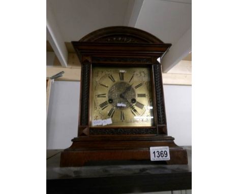 A brass faced mantel clock.