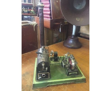 A German tin plate toy steam plant with boiler, chimney and generator driving a light plant. Circa 1910.