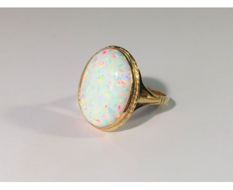 A 9ct yellow gold ring set large opal, size M.