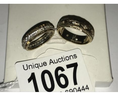 2 9ct gold eternity rings, sizes K and N.