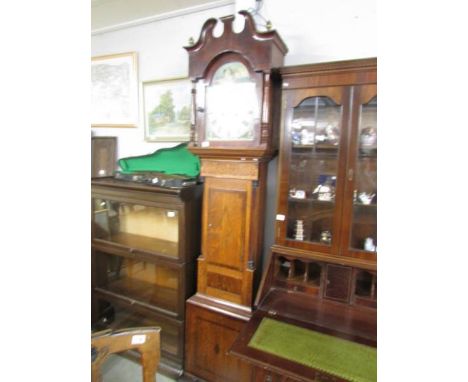 An oak inlaid painted dial 8 day long case clock marked Whitmore & Son, Northampton.