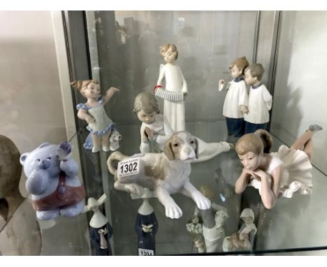 7 NAO (1 a/f) figures including Angel with concertina, ballerina, bear, choir boys (item missing from hand) etc.,