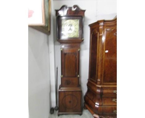 A long case inlaid clock with brass dial.