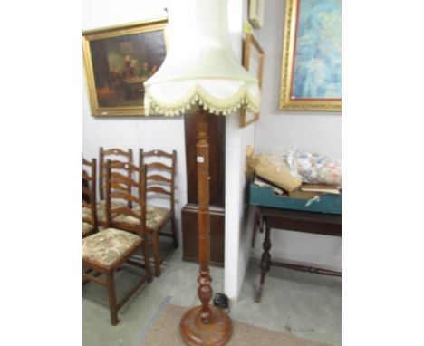 A good oak standard lamp with shade.