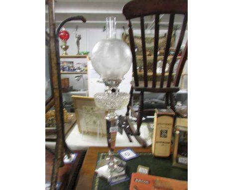 A late Victorian silver plate oil lamp.