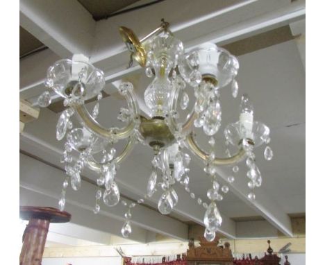 A 5 lamp glass chandelier.