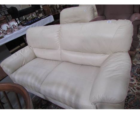 A cream leather 3 seat sofa.