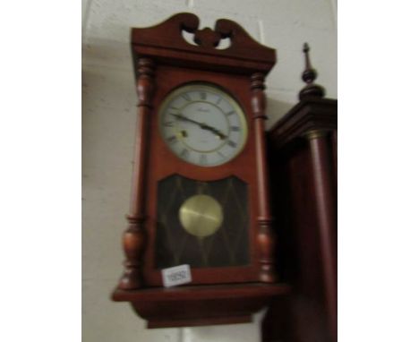 A wall clock,.