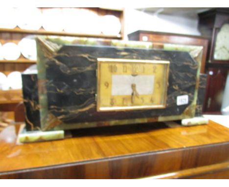 An art deco marble mantel clock.