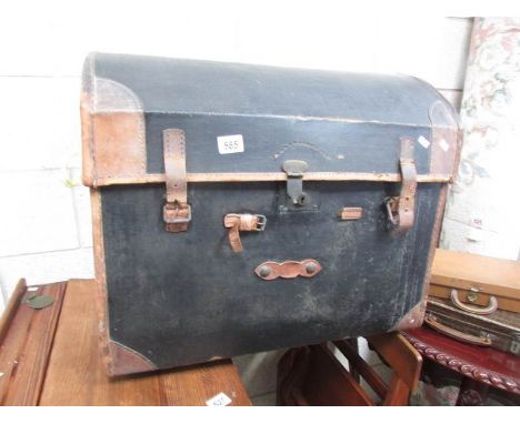 An old dome top travelling trunk.
