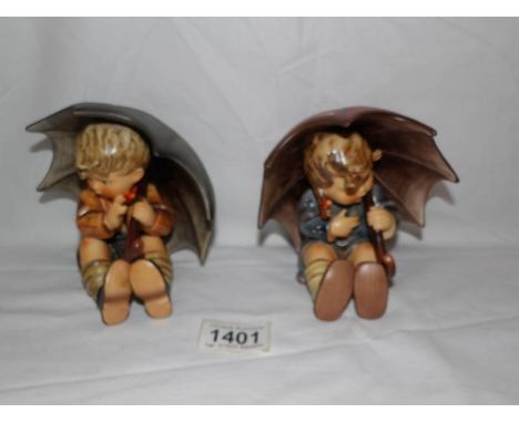 2 boxed Hummel Goebel figures being boy and girl with umbrella's.