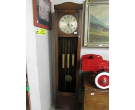 A long cased Enfield clock with pendulum and weights, (no glass to door).