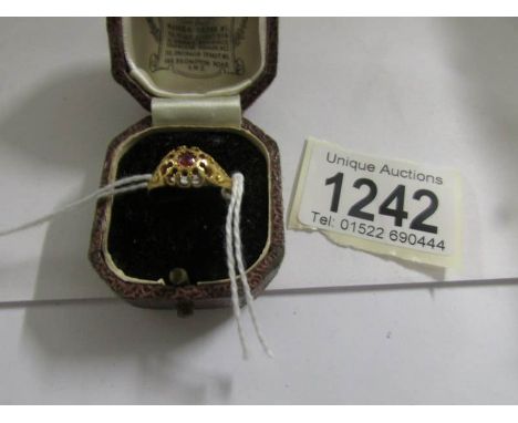 A ruby set ring in 18ct gold dated Birmingham 1913, size N.