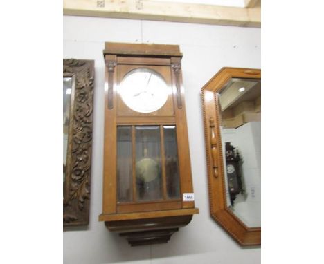 An Edwardian wall clock.