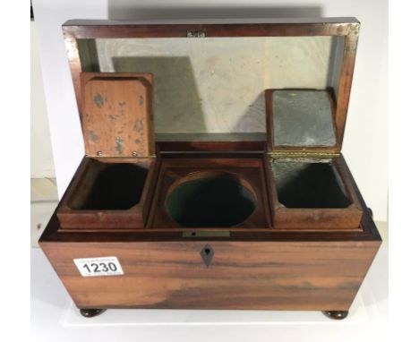 A Victorian mahogany tea caddy.