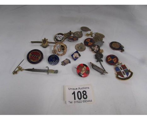 A mixed lot of badges including enamel, military etc.,