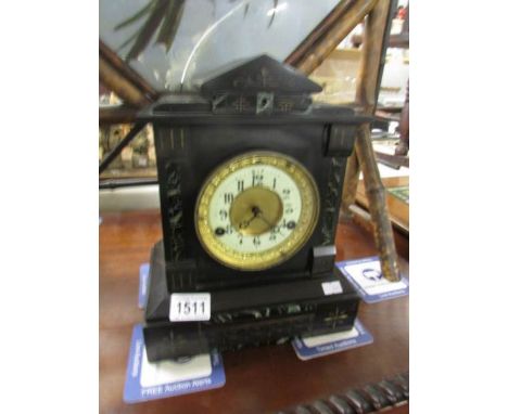 A black marble mantel clock.