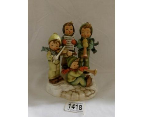 A boxed Hummel Goebel figure group 'Strike up the Band'.