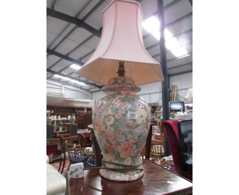 A pottery table lamp with shade.