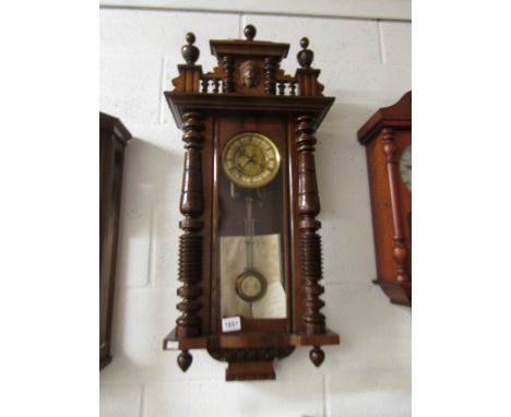 A mahogany Vienna wall clock.