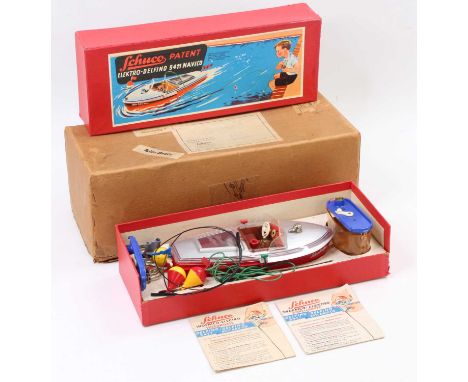 A Schuco Elektro-Delfino No. 5411 battery operated speed boat comprising of red &amp; silver body with brown tin printed inte