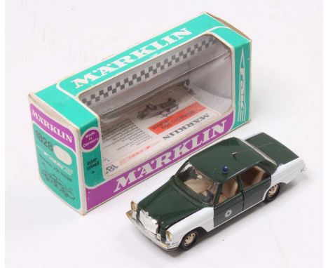 Marklin 1828 Mercedes 250 Polizei, comprising green and white body with blue roof light, housed in the original window displa
