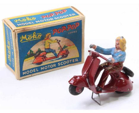 A MOKO Pop Pop Scooter finished in dark red with a black seat and rubber tyres, with a female rider, sold with its original p