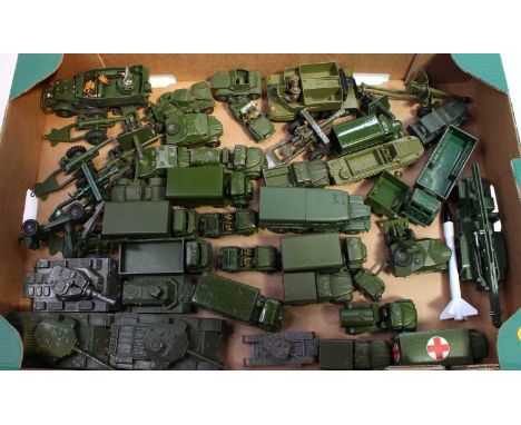 A tray containing a quantity of Dinky Toys military vehicles in play-worn and repainted condition including No. 689 Medium Ar