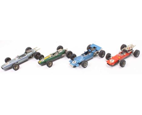 Four various loose Schuco large scale racing cars to include a BMW Formula 2 race car finished in silver, a Ferrari Formula 2