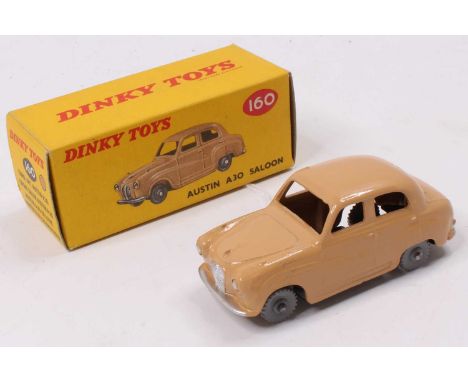 Dinky Toys No. 160 Austin A30 saloon, comprising tan body with grey plastic wheels housed in the original colour spot all-car