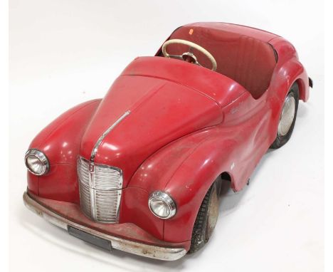 An original Austin J40 Pedal Car, finished in red with chrome fixtures and fittings, complete with headlights, engine interio