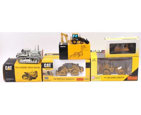 Five various boxed Caterpillar and Liebherr diecast construction vehicles and accessories, to include a Norscot Caterpillar 8