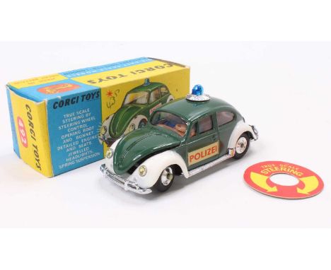 Corgi Toys No. 492 Volkswagen European police car comprising of a dark green and white body with blue roof light and two pass