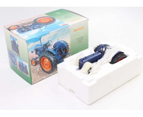 A Universal Hobbies 1/16 scale No. UH2638U Fordson Major E27N tractor comprising blue body with orange hubs, housed in the or