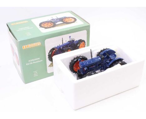A Universal Hobbies No. UH2816 Fordson E27N roadless tractor comprising dark blue body with orange hubs housed in the origina