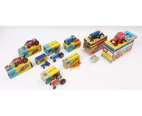 A collection of various boxed Britains and Corgi and Matchbox playworn and boxed agricultural diecast vehicles to include a M