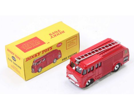 Dinky Toys No. 259 fire engine, with red body and silver detailing, spun hubs in the original pictorial yellow all-card box (