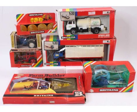 Seven various boxed Britains farming vehicles and accessories all in original window and card display boxes, the majority of 