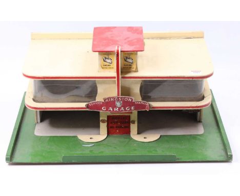 A vintage wooden garage and service station with a car lift, first-floor car showroom, and electric light (untested), approxi