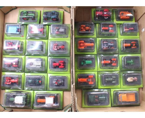 Two trays containing 32 various Hachette Part Works bubble packed farming agricultural diecast vehicles including a Fiat 40 B