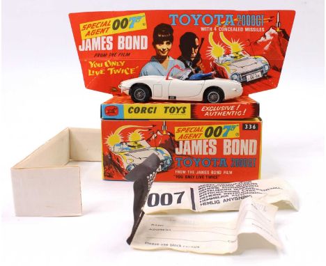 Corgi Toys No. 336 James Bond's Toyota 2000 GT comprising of a white body with black interior, and two figures, fitted with w
