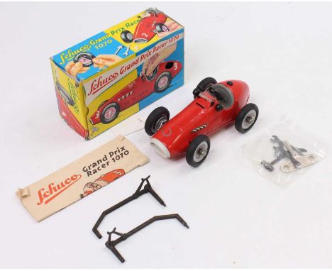 Schuco, No.1070 Grand Prix Racer, tinplate and clockwork example, finished in red with racing number 2, includes accessories,