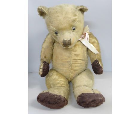 A large vintage Teddy Bear with jointed limbs