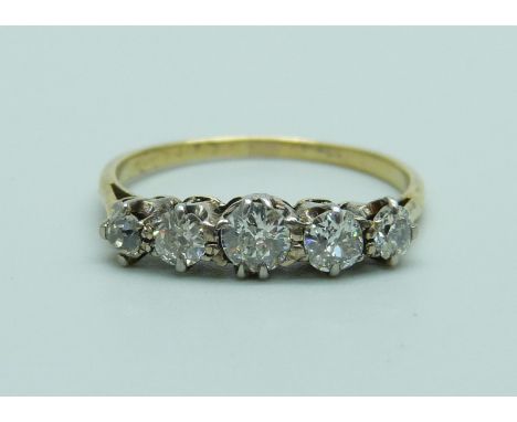 An 18ct gold five stone diamond ring, approximately 0.70ct weight, 2.1g, P