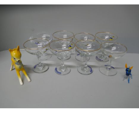 Eight Babycham glasses including 60th anniversary glass, a ceramic Babycham figure, glass Bamble and coaster
