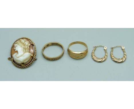 A 9ct gold stone set ring, a/f, 1.8g, a yellow metal ring, 1.3g, a 9ct gold mounted cameo brooch and a pair of yellow metal e