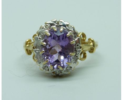 A 9ct gold amethyst and diamond cluster ring, 3.7g, S